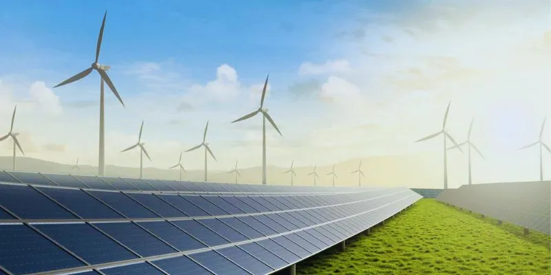 Solar panels and wind turbines in a field
